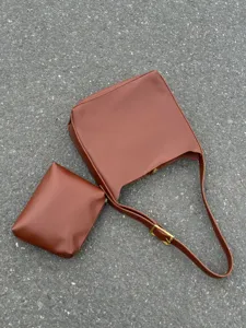 Brown slouchy shoulder bag set, minimalist PU leather bucket bag with clutch pouch.