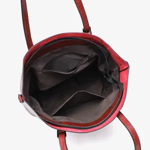 Detailed view of a red retro oil-wax leather women shoulder tote bag with pockets.