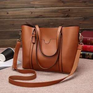 Brown soft leather tote handbag for women, large capacity shoulder bag with strap.