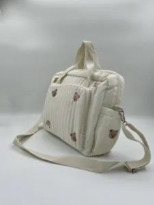 White quilted diaper bag with cute bear embroidery, large capacity shoulder crossbody bag for moms.