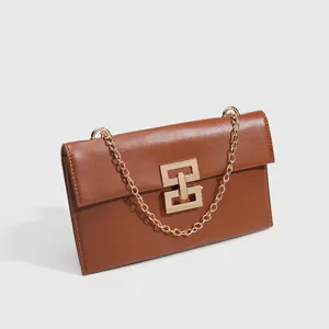 Brown leather chain shoulder bag for women, retro crossbody clutch with elegant clasp.