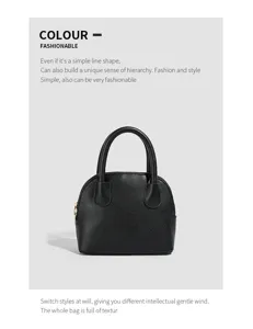Classic black dome handbag with double top handles, elegant minimalist style for daily wear.