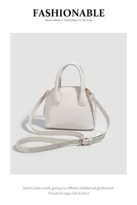 Stylish white shell handbag with top handle and crossbody strap, perfect for daily casual wear.