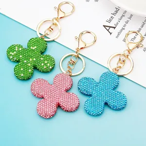 Portachiavi con quadrifoglio in strass scintillanti, ciondolo borsa in cristallo.