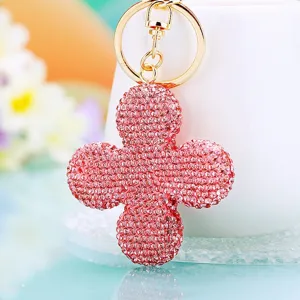 Dettaglio portachiavi quadrifoglio in strass, lucente ciondolo borsa cristallo rosa.