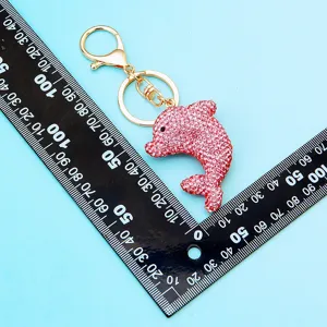 Pink rhinestone dolphin keychain, cute crystal car key ring and handbag pendant gift ornament.