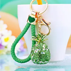 Green rhinestone pineapple keychain with braided strap, cute metal car key ring pendant gift.