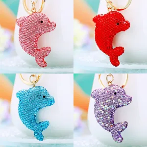 Close-up detail of sparkling rhinestone dolphin keychain pendant, exquisite craft and color.