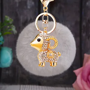 Cute fluffy sheep keychain with sparkling rhinestones and metal ring for car keys and bags.