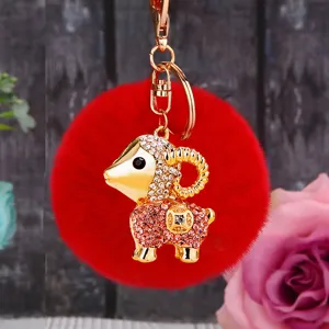 Cute plush sheep keychain with red pom pom and rhinestone gold metal bag pendant charm.