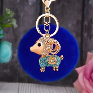 Cute fluffy sheep keychain with rhinestone metal pendant, stylish bag charm and keyring accessory.