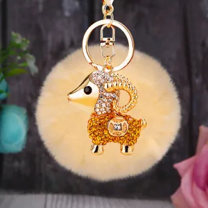 Cute plush sheep keychain with rhinestones and golden ring, perfect fluffy bag charm.