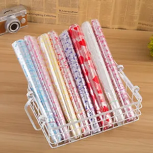 Princess floral mesh wrapping paper roll for bouquet packaging, colorful flower gift wrapping material.