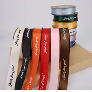 Colorful decorative ribbon rolls with English text print, perfect for gift wrapping and flower bouquet.