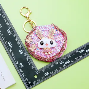 Cute rhinestone bunny mirror keychain for women, sparkly glitter bag charm and portable makeup mirror.