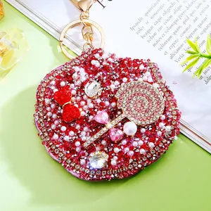 Bling rhinestone folding pocket mirror keychain with red lollipop and bow design pendant.
