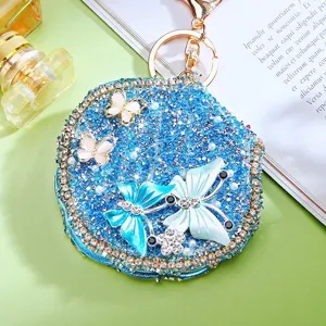 Blue rhinestone butterfly compact mirror keychain detailed view showing exquisite craftsmanship.