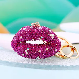 Rhinestone lips keychain, sparkling crystal red lip bag charm, metal ring accessory detail view.