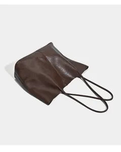Detailed view of the large capacity retro brown PU leather shoulder tote bag for daily commute.