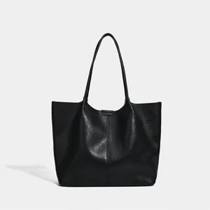 Black minimalist tote bag detail, large capacity single shoulder commuter daily use.
