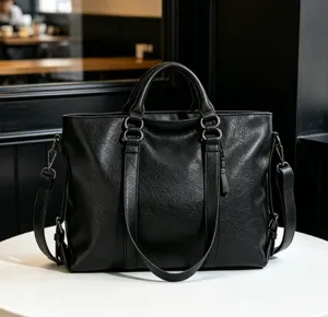 Black leather shoulder handbag, large capacity tote bag for women daily fashion use.