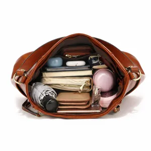 Large capacity brown shoulder bag interior view, showing spacious compartments for daily use.
