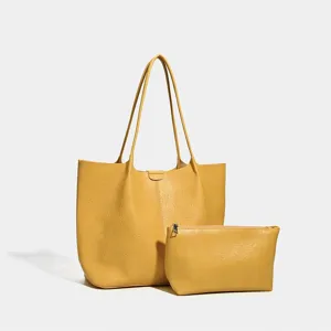 Yellow large capacity shoulder tote bag and pouch detail, simple retro commuter style.