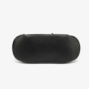 Black textured leather women handbag bottom detail, classic solid color tote bag base view.