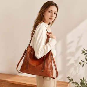 Brown leather shoulder tote bag detail view, multi-pocket design for women daily commuting.