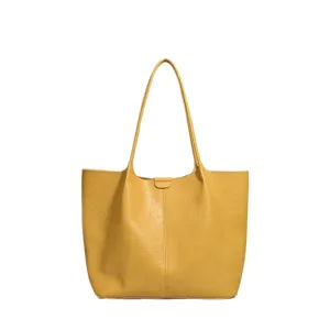 Large capacity yellow leather tote bag for women, stylish and versatile single shoulder commute bag.