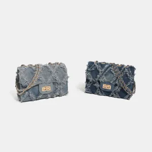 Stylish denim quilted cross-body chain bag with chic frayed edges for women daily commuting.