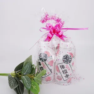 Japanese white peach flavored fiber drink packaged in transparent gift bag with pink bow.
