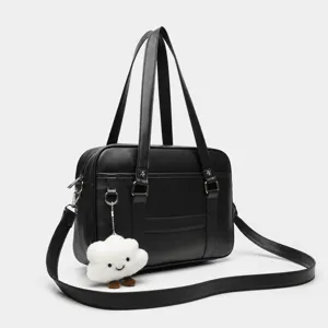Detailed view of black PU leather JK uniform bag with cute cloud pendant and straps.