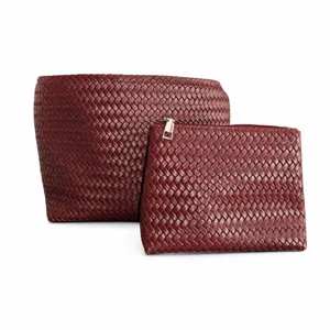 Woven leather bucket bag and pouch set detail, dark red intrecciato style handbag for women.