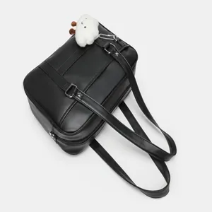 Detail view of the black PU leather JK uniform shoulder bag featuring a cute fluffy cloud plush charm.