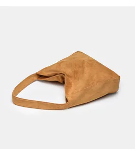Brown suede hobo shoulder bag detail, soft texture fabric, minimalist daily casual style.