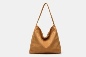 Detailed view of the soft faux suede shoulder tote bag texture, showing minimalist design.