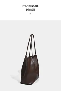 Vintage large capacity brown leather tote bag for women, casual single shoulder commuting bag.