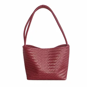 Red woven leather shoulder bag detailed design classic casual handbag everyday accessory.