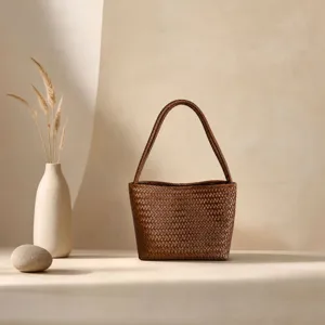 Brown woven leather shoulder bag, retro underarm bucket bag for women, chic daily tote.