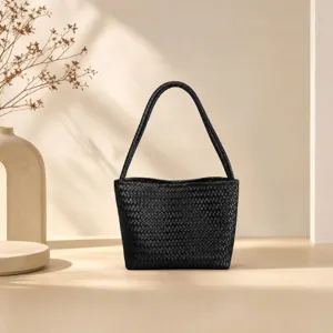 Black woven leather shoulder bag detail, stylish vintage basket tote purse for women.