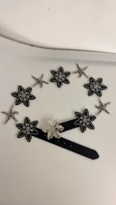 Retro black faux leather waist chain with silver metal starfish and flower rivet details for women.