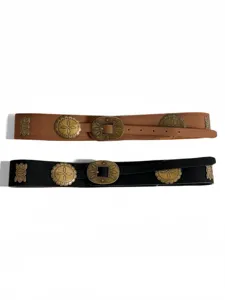 Close-up of vintage western retro style leather belt set with antique metal medallions.