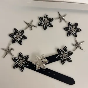 Retro starfish metal imitation leather waist belt with flower rivets for women fashion accessory.