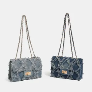 Denim chain shoulder bag with frayed quilted patchwork design, classic flap style crossbody bag.