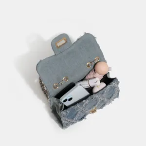 Classic denim chain shoulder bag for women, stylish quilted flap crossbody bag with spacious interior.