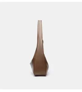 Side view detail of the brown leather hobo shoulder bag, showing slim profile and strap.