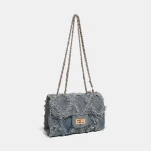 Trendy denim chain shoulder bag with frayed patchwork design and classic quilted flap structure.