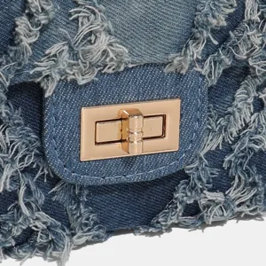 Denim patchwork crossbody bag detail, frayed edge flap design with gold turn-lock hardware.