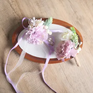 Artificial carnation wrist flower and boutonniere set, light pink wedding floral accessory.